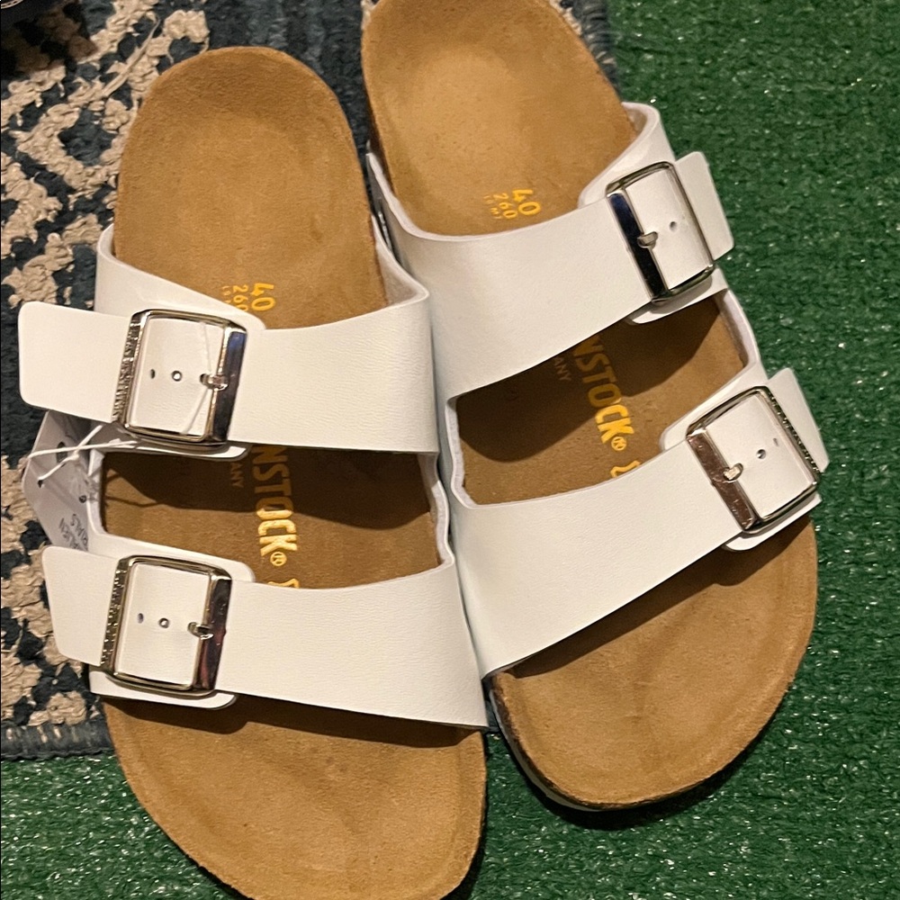 Birkenstock White Sandals with Metallic Buckles